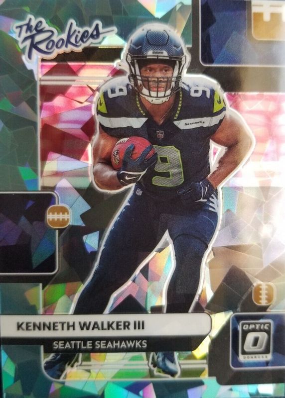 Kenneth Walker III 2022 Optic #TR-18 The Rookies - Ice /15 PSA 10