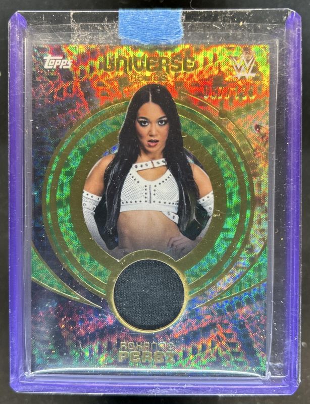2025 Topps Universe WWE #UNR-RPE Universe Relics - Green Electric /199