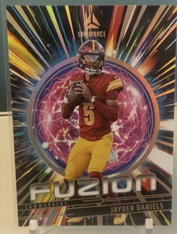 Jayden Daniels 2025 Luminance #15 Fuzion - Orange /100 RAW