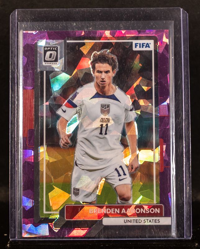 Brenden Aaronson 2022 Donruss #168 Optic - Purple Ice /99 RAW