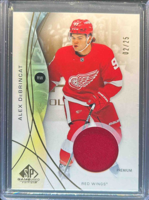 Alex DeBrincat 2024 SP Game Used #23 Base Jersey - Gold Premium /25 RAW