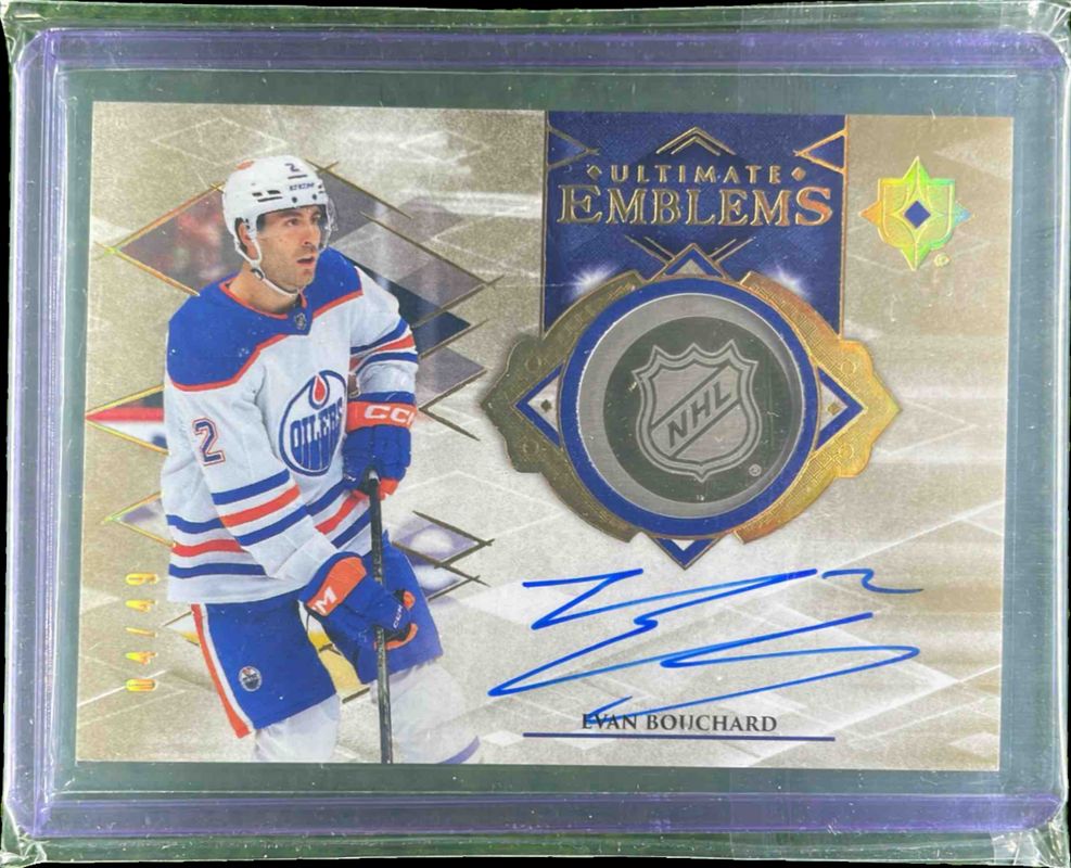 Evan Bouchard 2023 Ultimate Collection #UE-EB Ultimate Emblems - Gold Auto /25 RAW